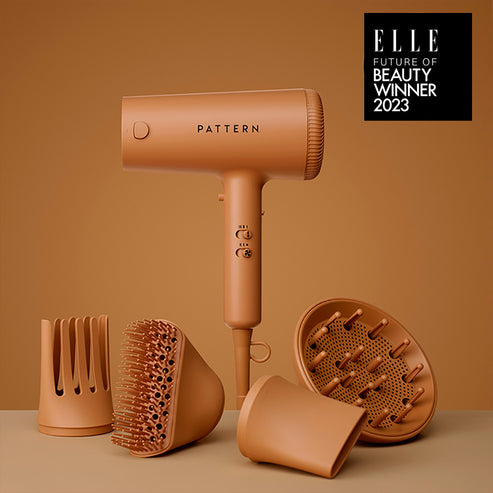 brown colored blow dryer with four unique attachments for curly hair