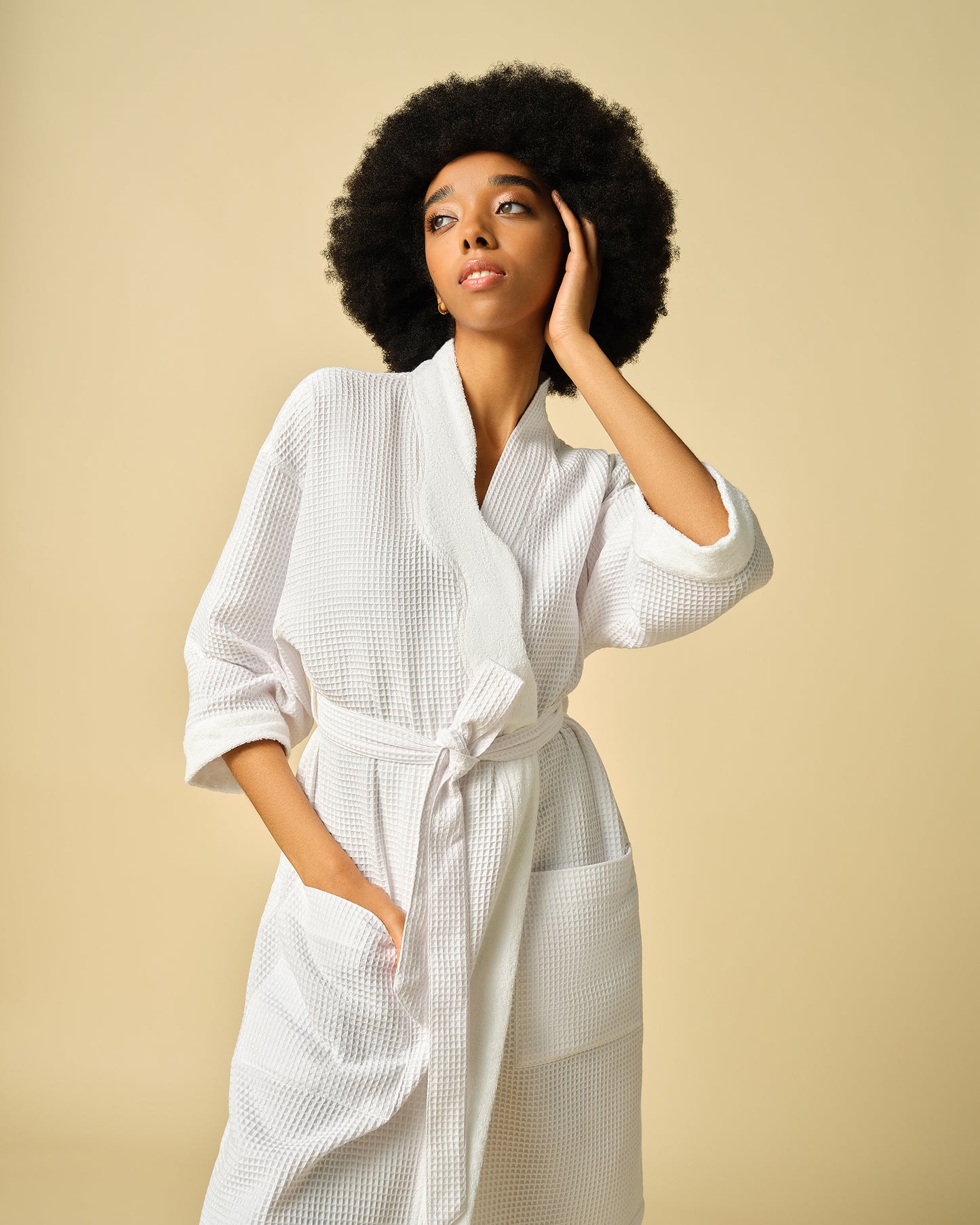 PATTERN x SERGIO HUDSON Curl-Conscious Robe - White lightweight cotton robe with belt and pockets, worn with natural afro hairstyle, from PATTERN Beauty by Tracee Ellis.