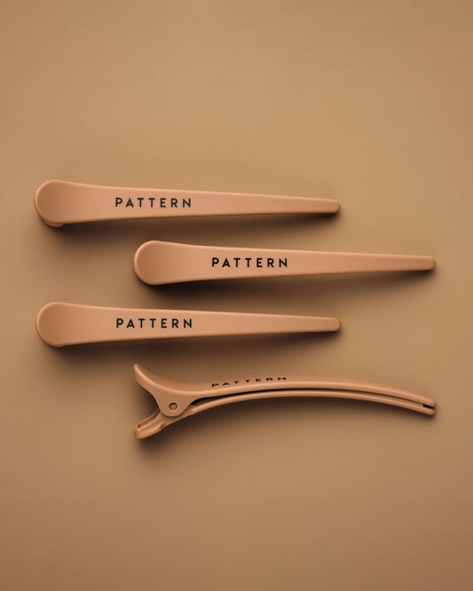 The Curling Iron & More Bundle - Set of four matte tan hair clips with PATTERN Beauty by Tracee Ellis Ross logo on each clip.
