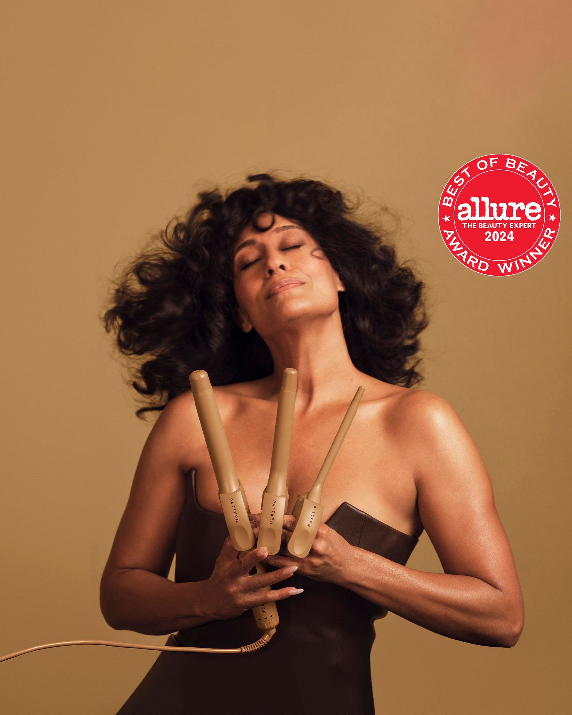 The Curling Iron & More Bundle - PATTERN Beauty by Tracee Ellis Ross Curling Iron & More Bundle with three gold curling irons against tan background.