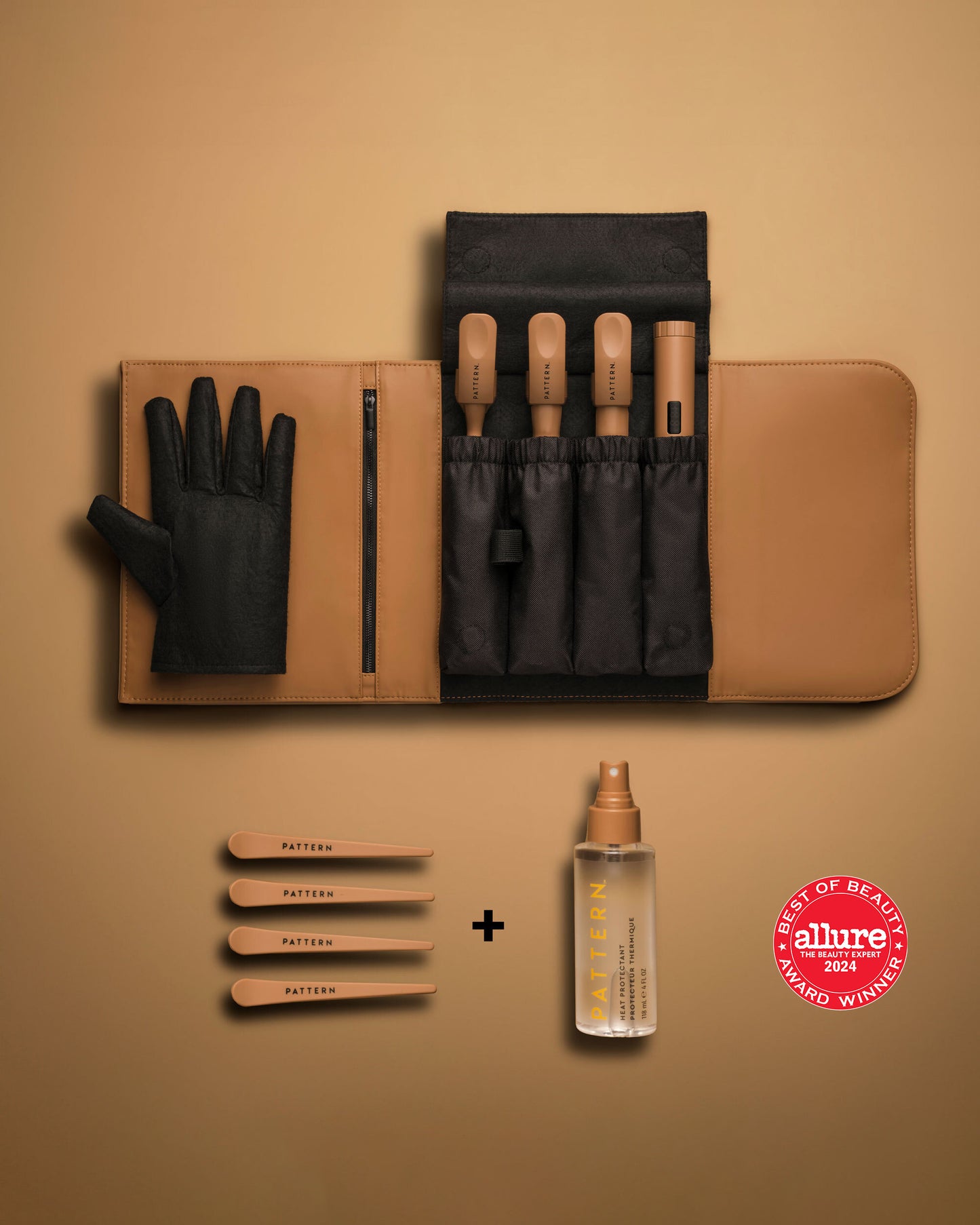 The Curling Iron & More Bundle - PATTERN Beauty by Tracee Ellis Ross curling iron bundle with black gloves, heat-resistant pouch, styling clips, and spray.
