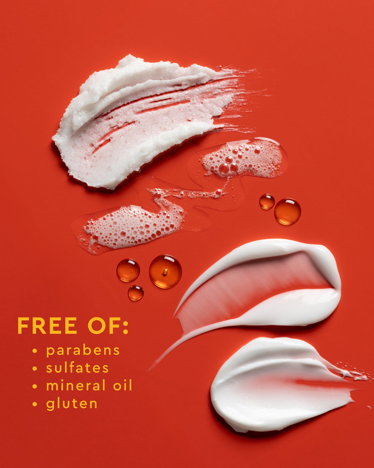 Moisture Rich Body Cream - PATTERN Beauty by Tracee Ellis Ross Moisture Rich Body Cream swatches and water droplets on orange background with product.