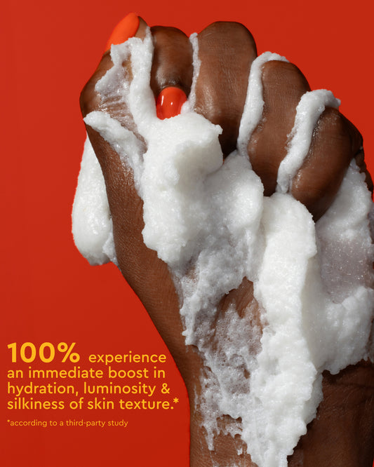 Radiant Skin Trio - Hand covered in foamy white cream against orange background for PATTERN Beauty by Tracee Ellis Ross Radiant Skin Trio.