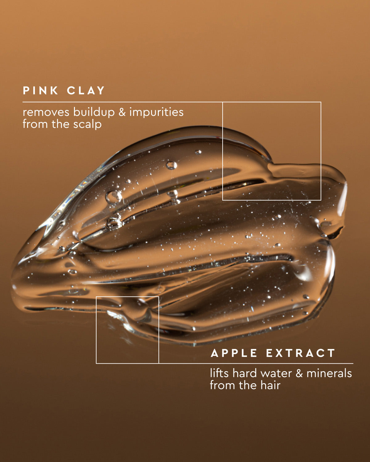 A glossy brown translucent cosmetic smear on a brown gradient background with white text reading 'PINK CLAY' and 'APPLE EXTRACT' plus descriptive claims about scalp and hair buildup.