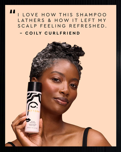 A woman with styled curly hair holds a bottle of Pattern Curly Curling Shampoo against a peach background, with a testimonial quote at the top.