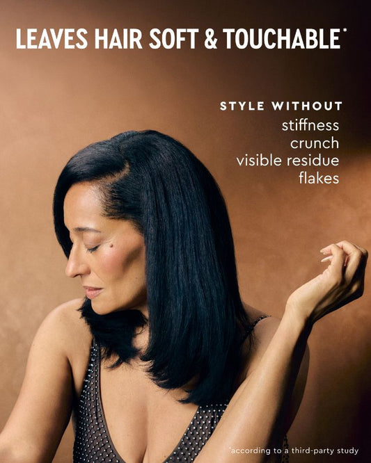 Flexible Hold Spray - PATTERN Beauty Flexible Hold Spray ad featuring a woman with sleek black hair and soft, touchable hold messaging.