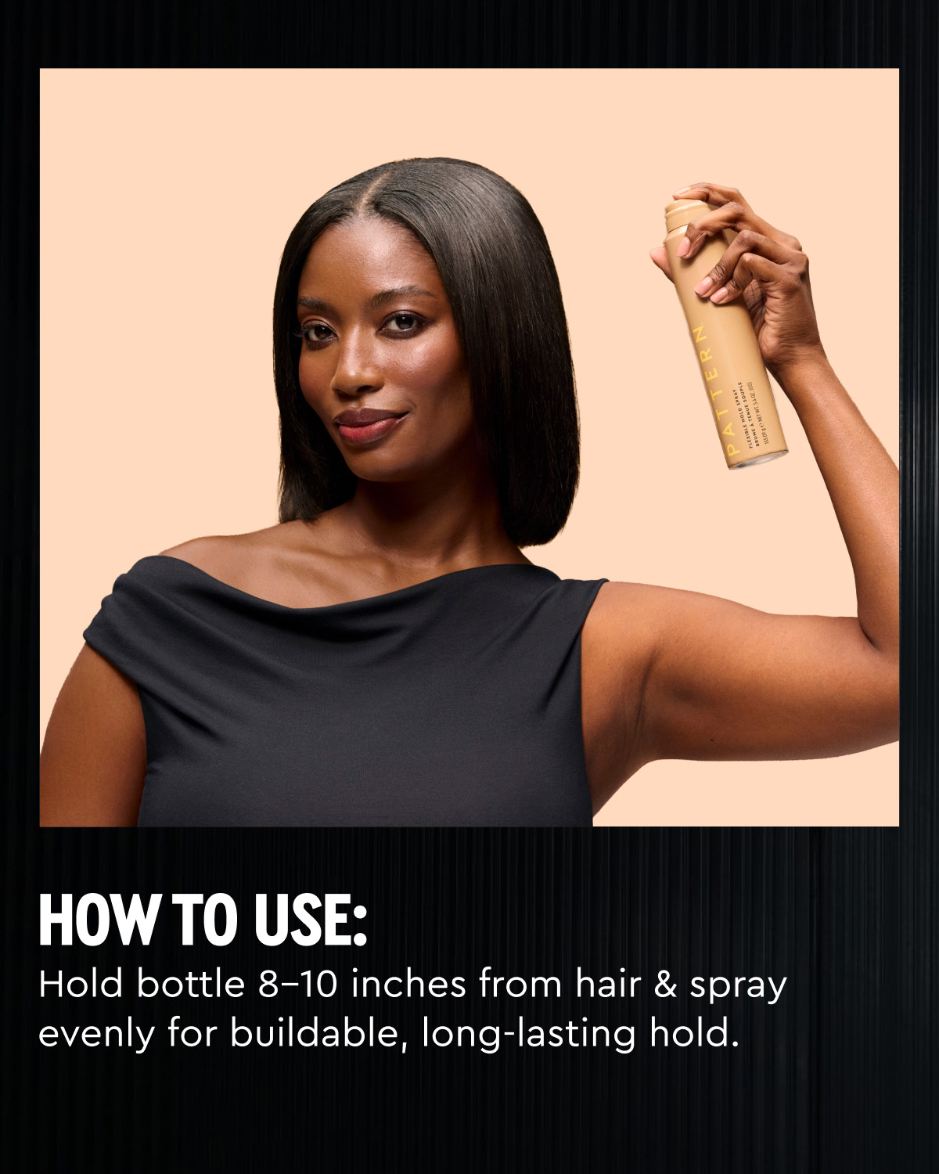 Flexible Hold Spray - PATTERN Beauty by Tracee Ellis Ross Flexible Hold Spray bottle held above a model’s shoulder.