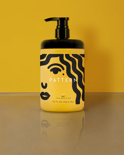Curl Gel - Yellow plastic bottle of Pattern Beauty Curl Gel with black pump and abstract black face design on label.