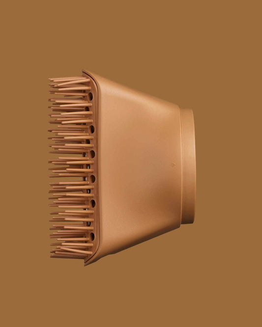 The PATTERN Blow Dryer - Copper-colored hair dryer diffuser attachment with wide, evenly spaced prongs and smooth matte finish.