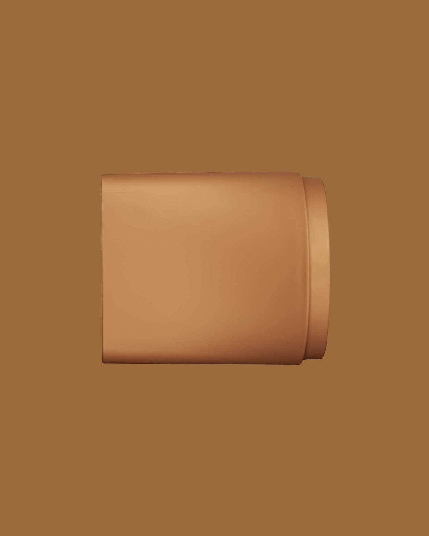 The PATTERN Blow Dryer - Matte bronze compact nozzle attachment for PATTERN Beauty blow dryer with smooth rounded edges.