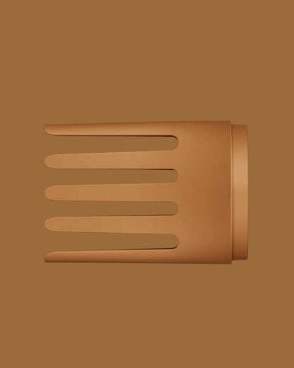 The PATTERN Blow Dryer - Matte terracotta wide-tooth comb attachment for PATTERN Beauty blow dryer with four broad, evenly spaced prongs.