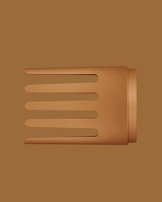 The PATTERN Blow Dryer - Matte terracotta wide-tooth comb attachment for PATTERN Beauty blow dryer with four broad, evenly spaced prongs.